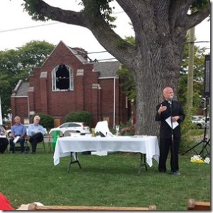 Pastor Jimmy Madsen preaching at Sunday's outdoor service.