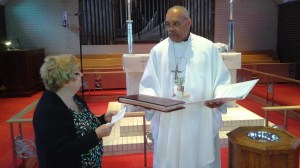The parish records are handed to the bishop.