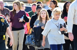 Survivors are evacuated from the scene of a shooting on December 2, 2015 in San Bernardino, California. FREDERIC J. BROWN/AFP/Getty Images)