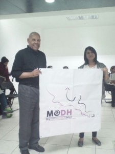 Alaide and me hold up the mission logo.